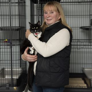 Photo of owner holding cat